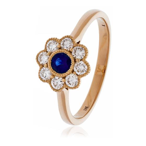 0.65ct Blue Sapphire and Diamond Bezel Set Halo Ring