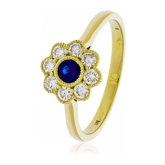 0.65ct Blue Sapphire and Diamond Bezel Set Halo Ring