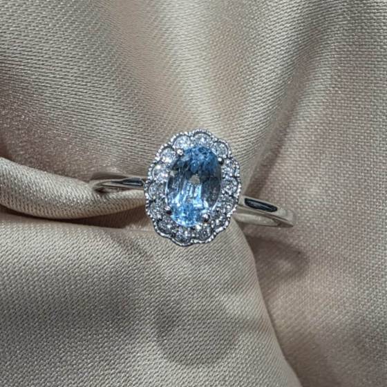 0.80ct VS/E-F Oval Cut Blue Topaz Gemstone Halo Ring