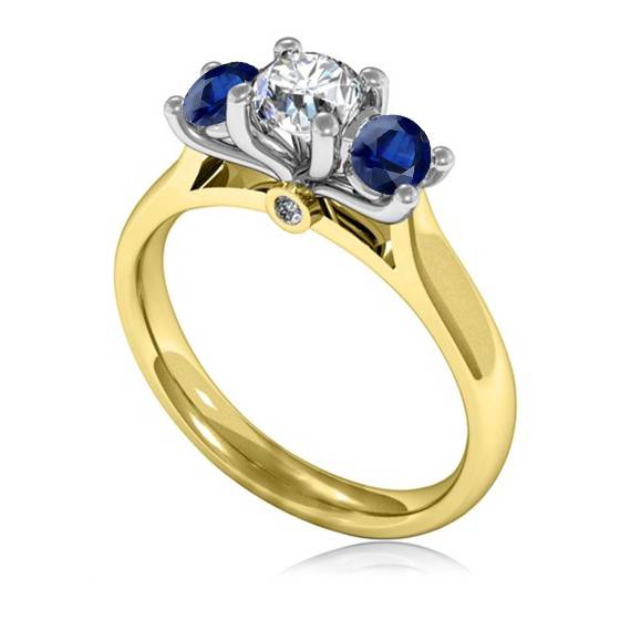 Modern Round Diamond and Blue Sapphire Trilogy Ring
